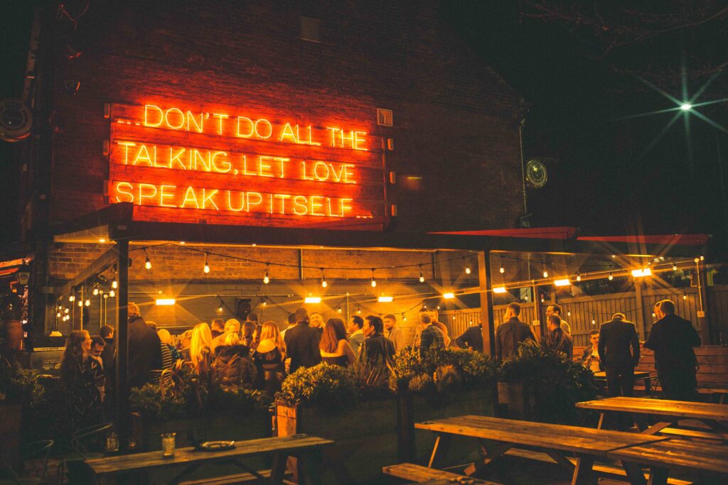 Crowd dancing at The Riverside Kelham New Year’s Eve Throwback Party with DJ lights and retro vibes